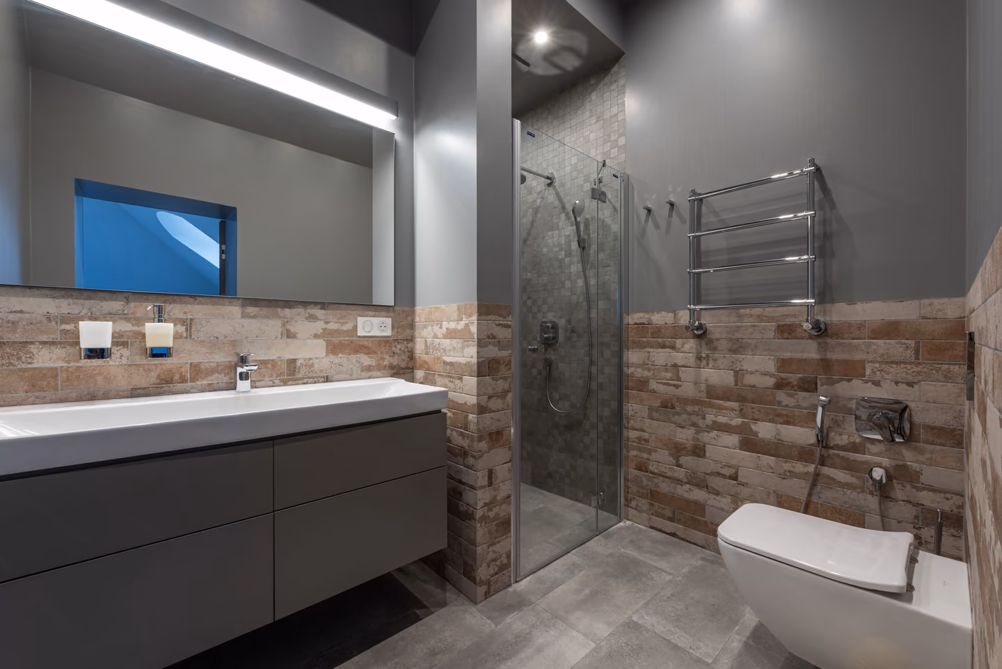 Compare footprint, threshold, drainage, fixtures, storage, seating, glass, splash control, and cleaning.