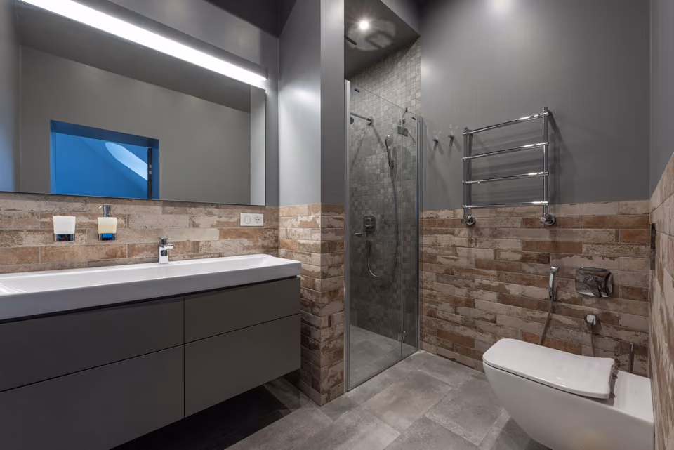 Glass walk-in shower with neutral tile
