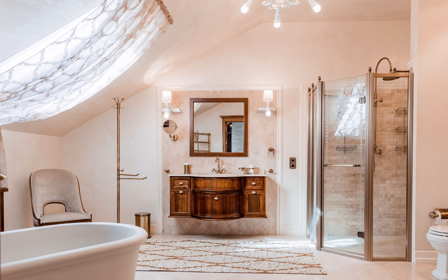 Warm neutral bathroom with a wood vanity, freestanding tub, and softly lit shower