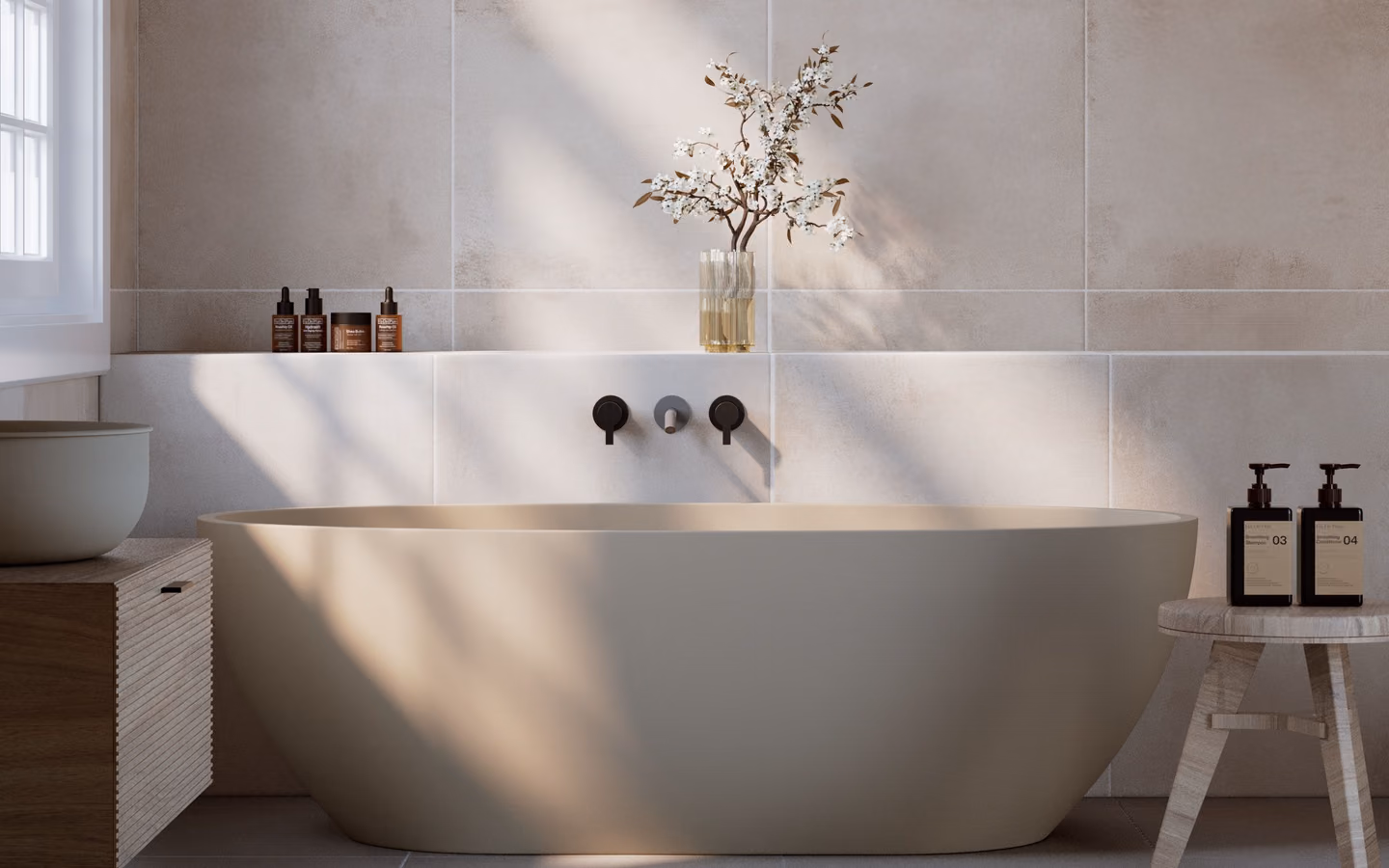 Spa-inspired bathroom with softly lit stone surfaces, built-in shelving, and calm neutral styling