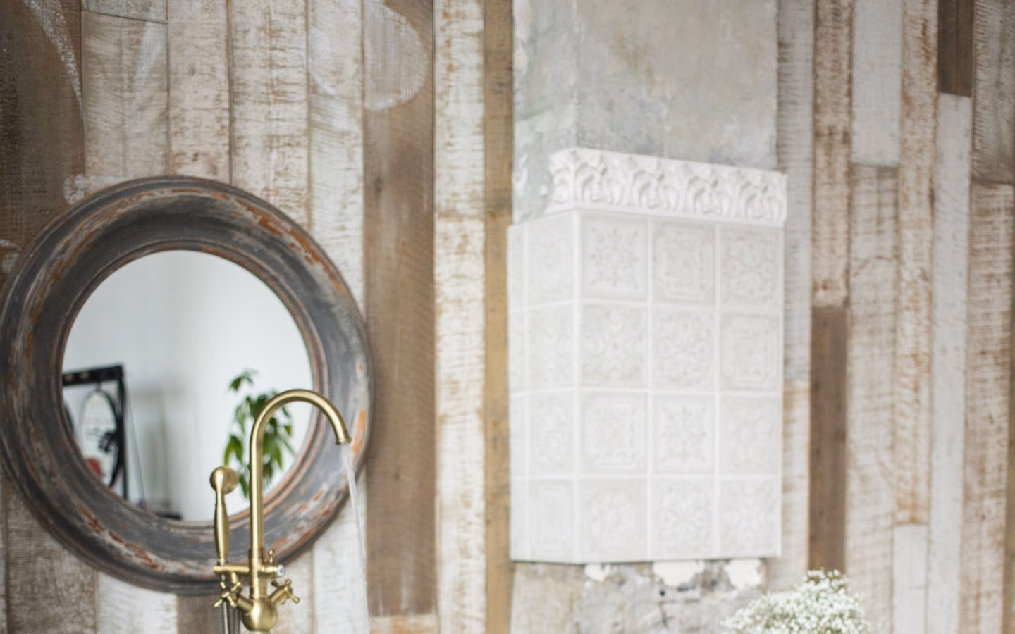 Updated traditional bathroom with a freestanding tub, vintage-inspired fixtures, and soft spa styling