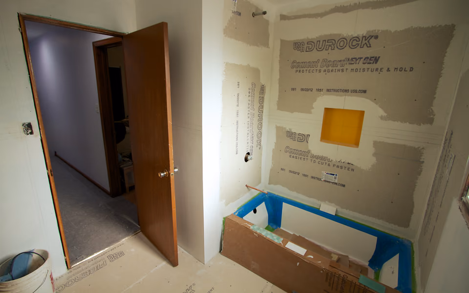 Shower walls coated with waterproofing before tile installation