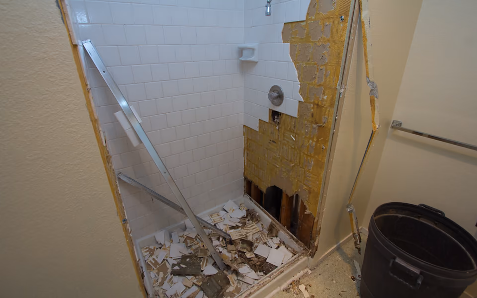 Active shower demolition with debris contained inside the bathroom