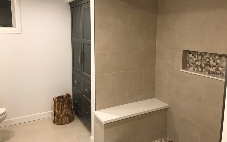Built-in bench inside a finished tile shower